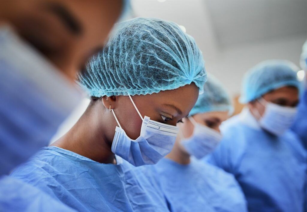 African American nurse performing a medical procedure